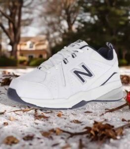 New Balance women's grey and white 608v5 cross-trainer shoes with stability arch support.