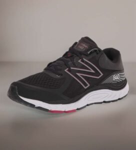 New Balance women's white leather slip-on walking shoe with supportive cushioning and a stable rubber outsole.