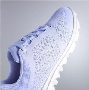 Close-up of the light purple breathable mesh upper and lacing system on the Propét Women’s TravelActiv sneaker.