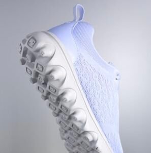 close-up of the white, textured outsole of a light purple Propét Women’s TravelActiv sneaker, showing the lightweight tread pattern for traction.