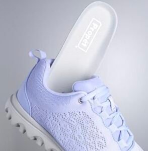 Propét Women’s TravelActiv light purple slip-on medical sneaker with a removable cushioned insole.