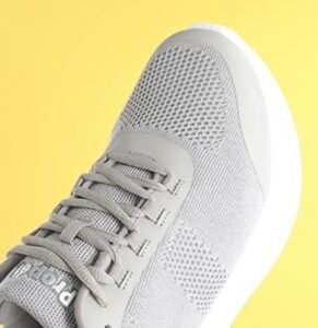 Close-up of the grey knit breathable upper and secure lacing system of the Propét Men's B10 Usher sneaker.